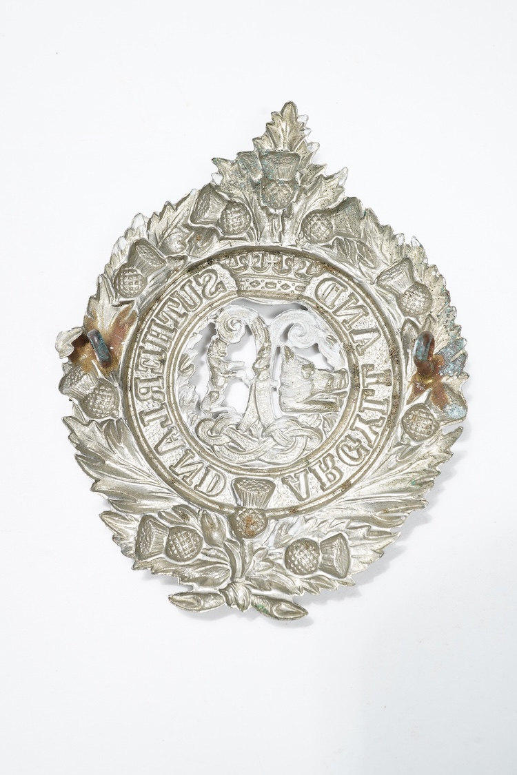 A First World War medal trio awarded to 2140 SJT. G. Watson. Argyll and Sutherland Highlanders, together with the related cap badge and two photographs of Watson in Highlanders uniform and printed as postcards